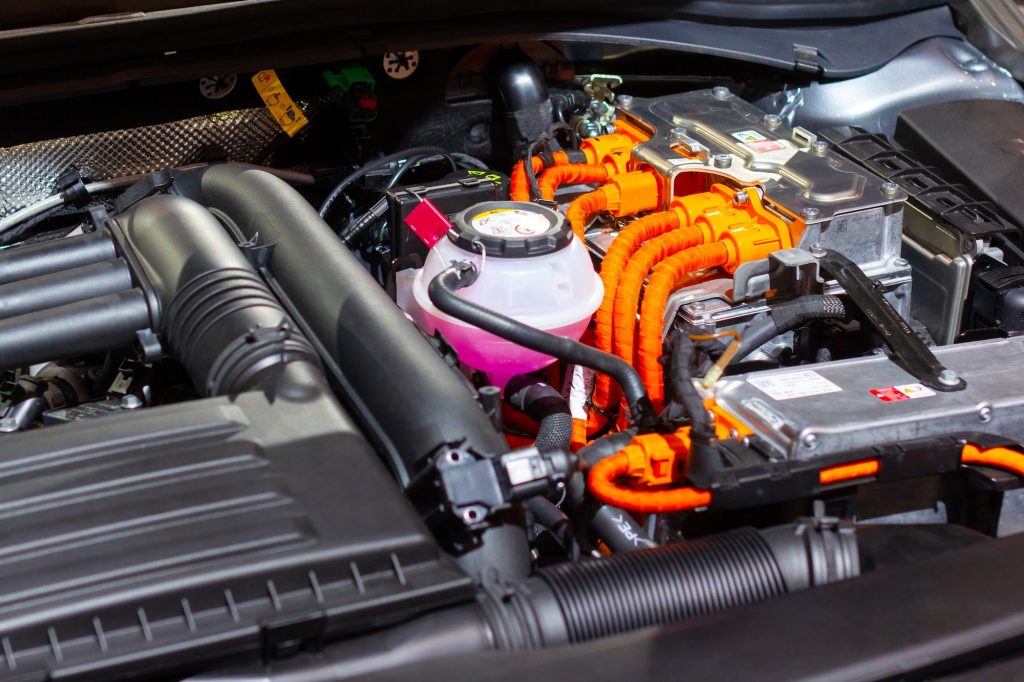 Under the hood of a hybrid or electric car. Detail of electric car engine